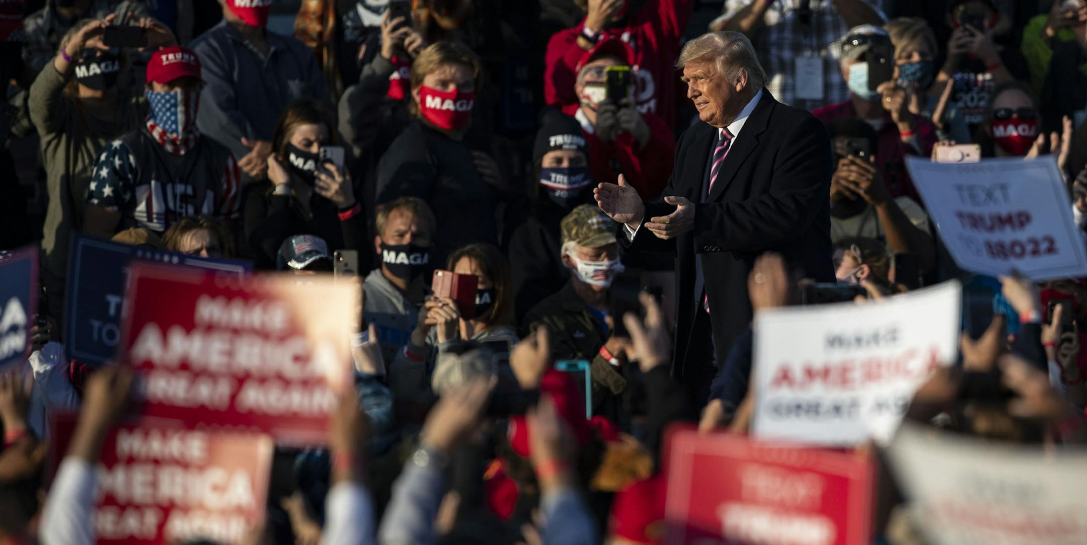 President Trump walked on a catwalk to his podium as thousands of supporters cheered and chanted. ] ALEX KORMANN • alex.kormann@startribune.com President Trump visited Bemidji, Minn. for a campaign rally at Bemidji Aviation Services on Friday September 18, 2020. The president has eyed northern Minnesota as his key to flipping the state red.