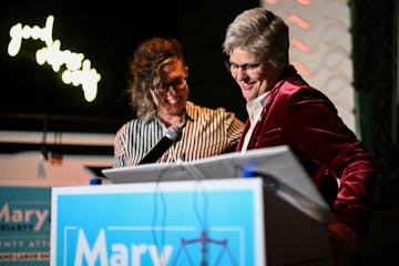 Hennepin County Attorney-elect Mary Moriarty, right, spoke to supporters alongside her partner, Jen Westmoreland, after they arrived victorious at Mor