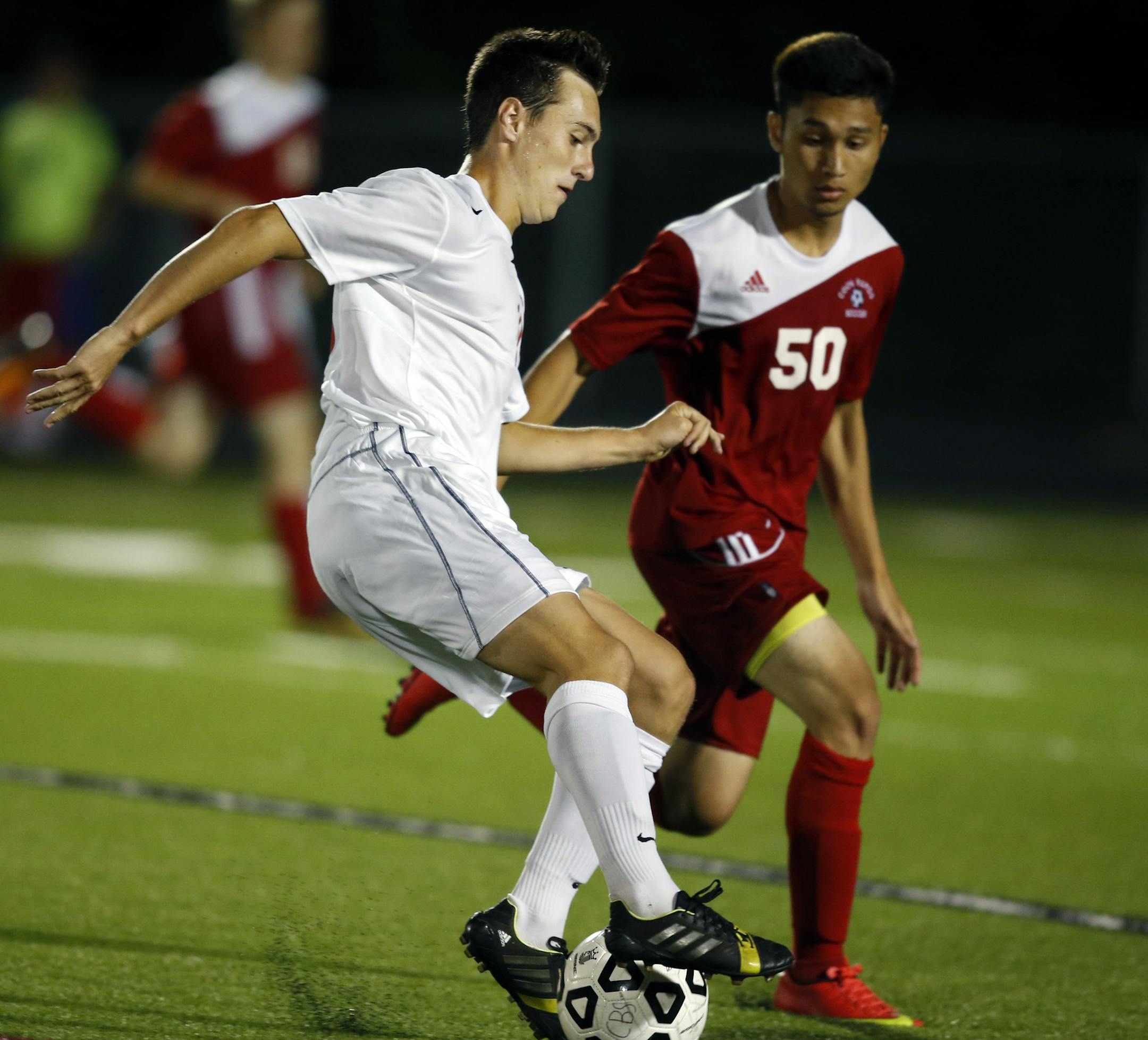 At a varsity boys soccer game between Centennial and Coon Rapids in Lino Lakes, Brandon Henderson(10) battled for control of the ball against Raven Noguerraga,(50) of Coon Rapids. ] Richard Tsong-Taatarii/rtsong-taatarii@startribune.com