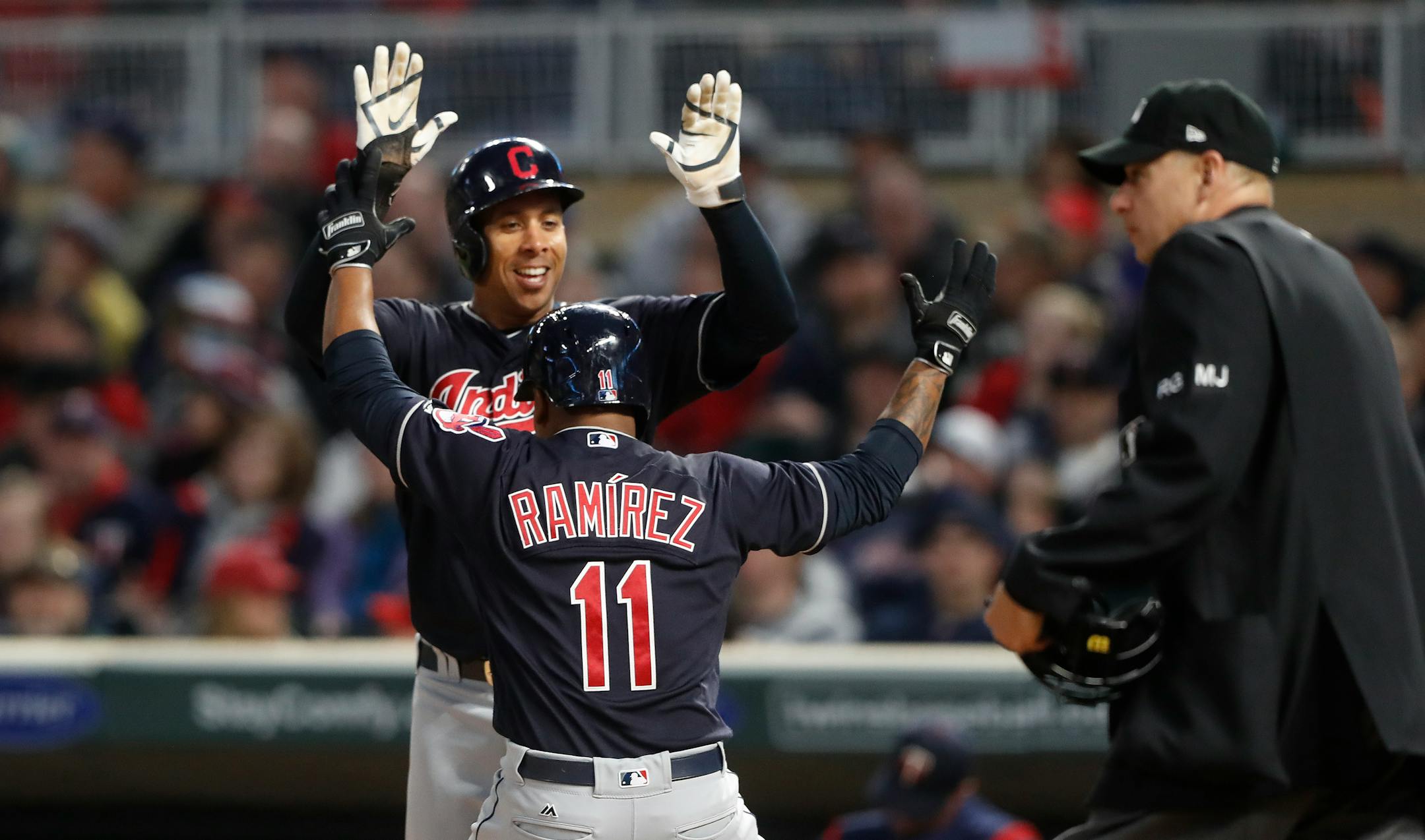 Cleveland Indians second baseman Jose Ramirez (11) celebrated his two run homer with Michael Brantley in the third inning at Target Field