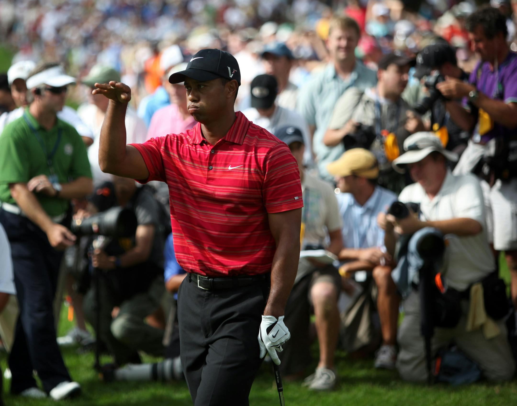 Tiger Woods showed his disappointment with a shot during the fintsal round of the 2009 PGA Championship at Hazeltine National. Y.E. Yang outdueled Woods for the title, and Tiger has yet to win a major since.