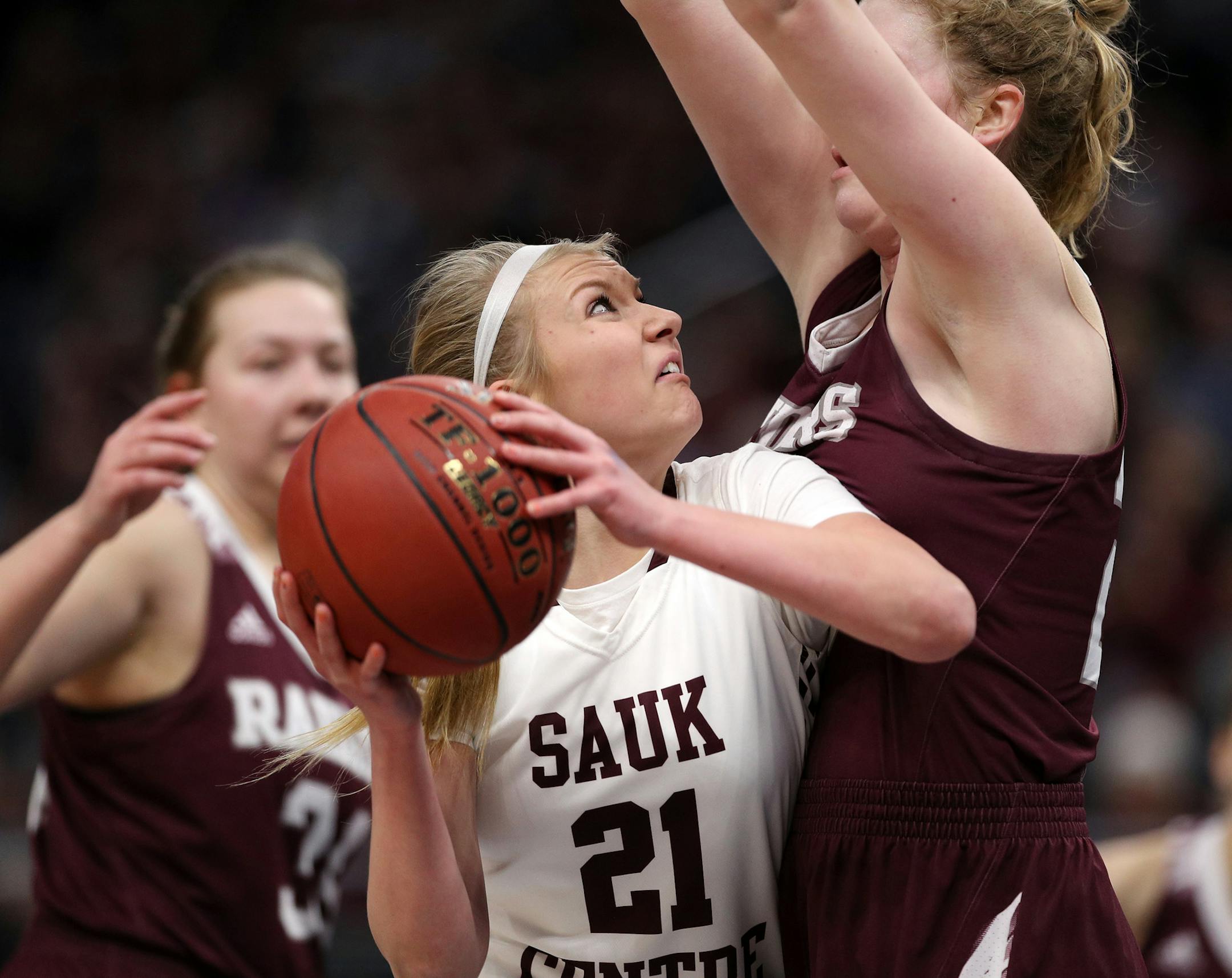 Sauk Centre High School guard Tori Peschel (21) drove to the basket as Norwood-Young America High School center Bren Fox (23) reached up to defend in the first half. ] ANTHONY SOUFFLE ï anthony.souffle@startribune.com Sauk Centre High School played Norwood-Young America High School in a Class 2A semifinals basketball game Friday, March 16, 2018 at the Target Center in Minneapolis.