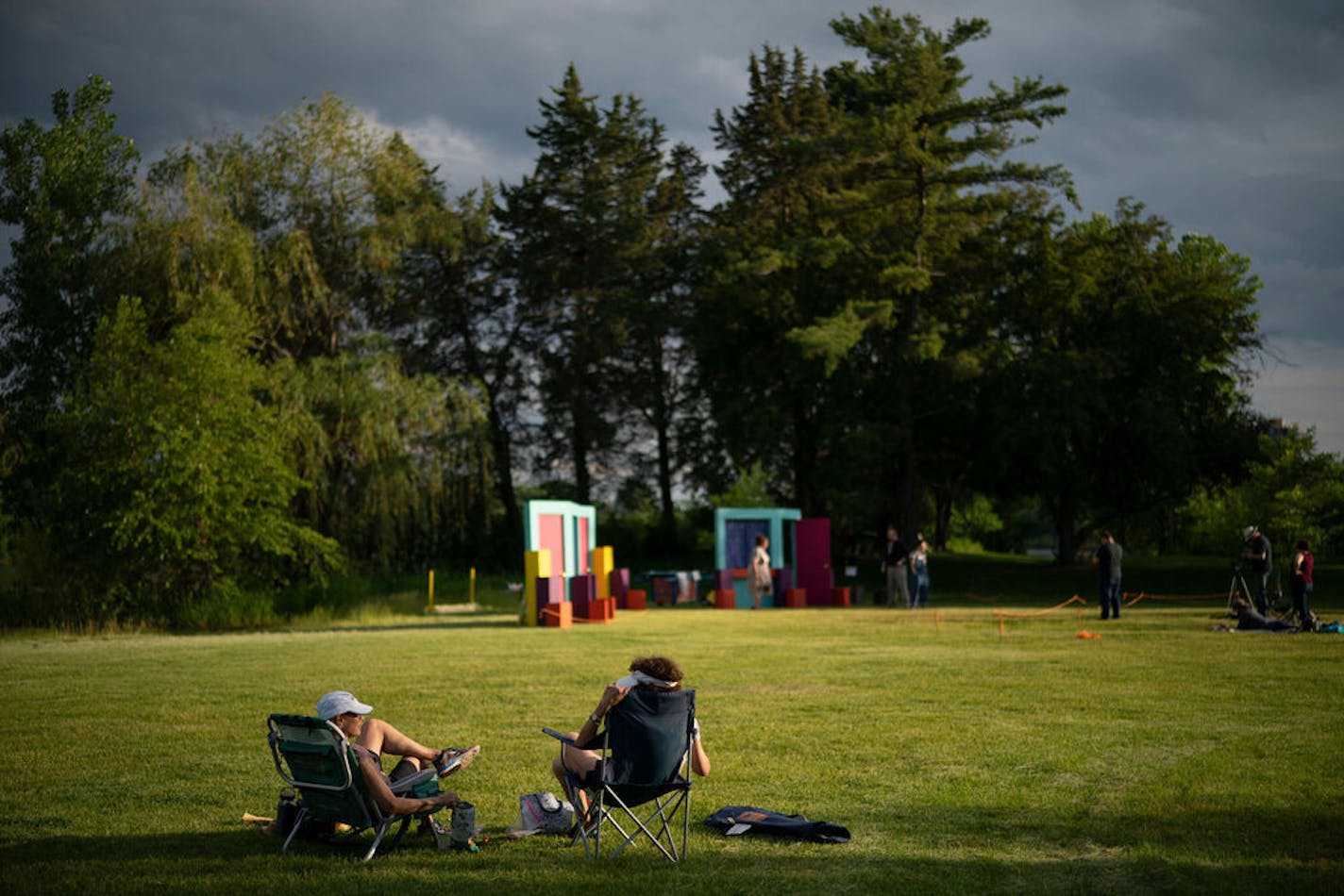 Diane Kolodziej , left, and Jill Peacock were walking around Lake of the Isles and noticed the rehearsal would be happening so they returned with snacks and watched the show. ] JEFF WHEELER • jeff.wheeler@startribune.com