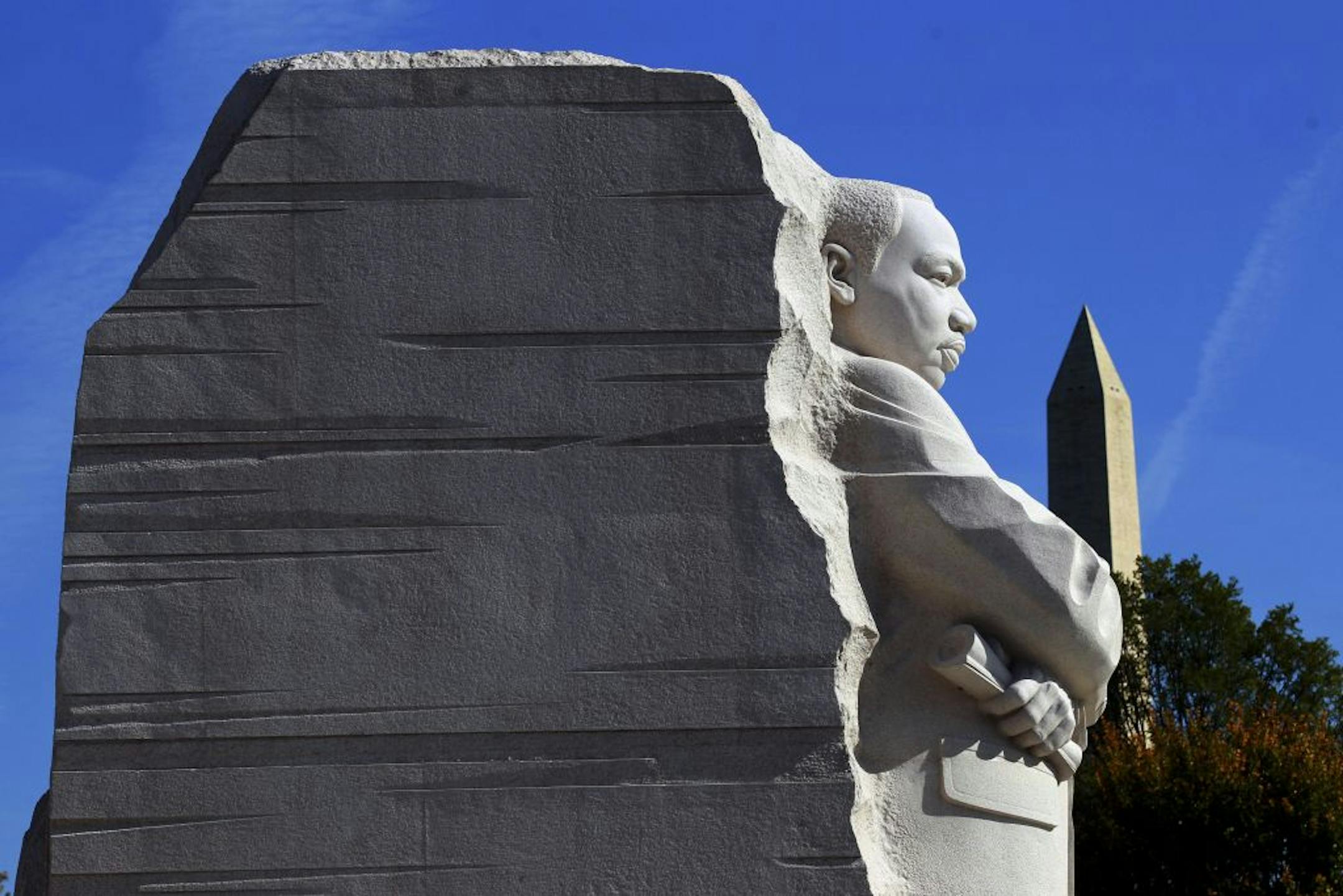 The monument at the Martin Luther King Jr. Memorial dedication, with the Washington Monument in the background, on the National Mall in Washington, Oct. 16, 2011. President Barack Obama called on Americans to use the memory of the Rev. Dr. Martin Luther King Jr. to help push for progress in today's economically tough times.