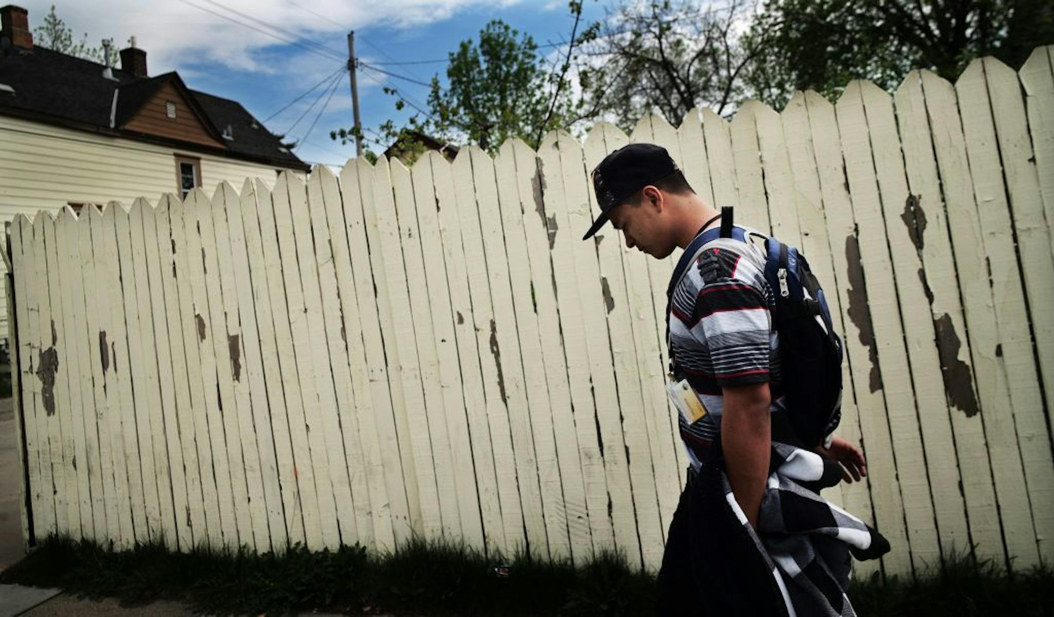 Elder Leiva,17, walks home after school.