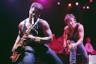 Bruce Springsteen, right, watched Clarence Clemons play the saxophone during a December 12, 1984 concert before 23,000 fans in Rupp Arena in Lexington