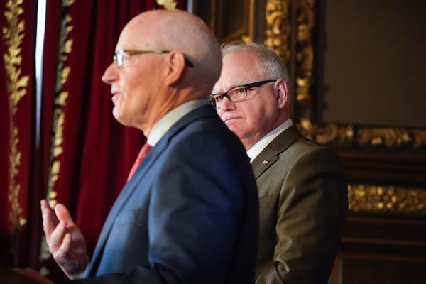 Minnesota Management and Budget Commissioner Myron Frans with Gov. Tim Walz in March.