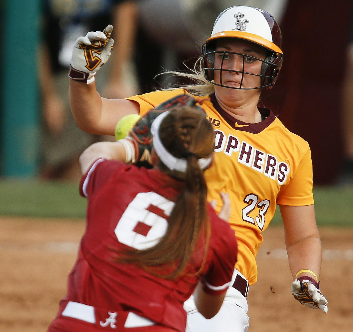 Alabama shortstop Sydney Booker takes a throw forcing out Minnesota base runner Kendyl Lindaman during Alabama's 1-0 win over Minnesota in the NCAA Tuscaloosa Regional championship game Sunday, May 20, 2017 in Rhoads Stadium in Tuscaloosa, Ala. (Gary Cosby Jr./The Tuscaloosa News via AP)