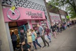 Donut lovers lined the sidewalk as the doors opened at Glam Doll donuts for National Donut Day, Friday, June 1, 2018 in Minneapolis, MN.