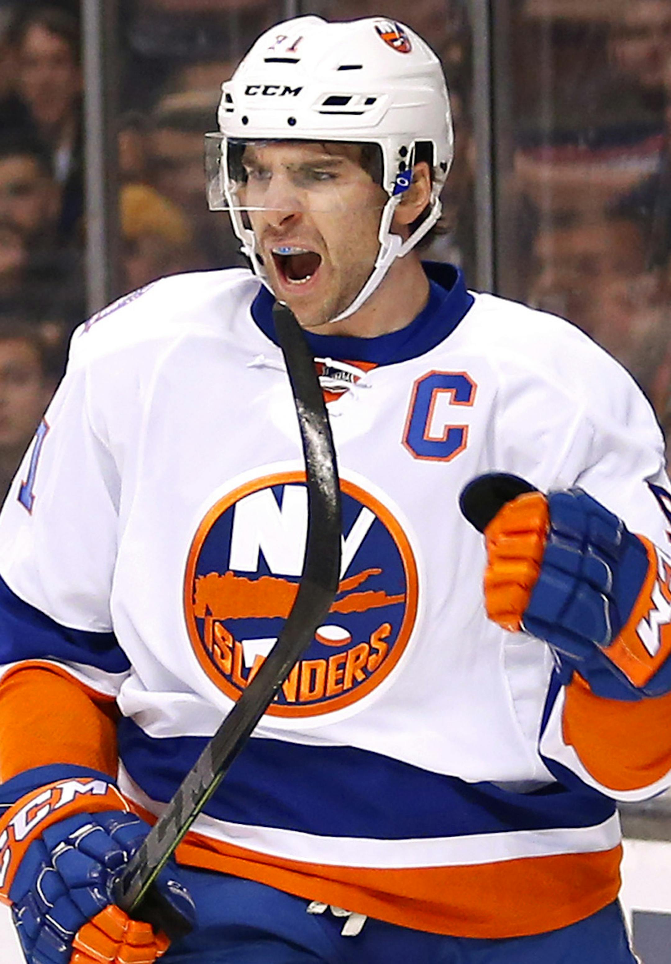 New York Islanders' John Tavares celebrates his goal against the Boston Bruins during the first period of an NHL hockey game in Boston, Saturday, Feb. 7, 2015. (AP Photo/Winslow Townson) ORG XMIT: BXG102