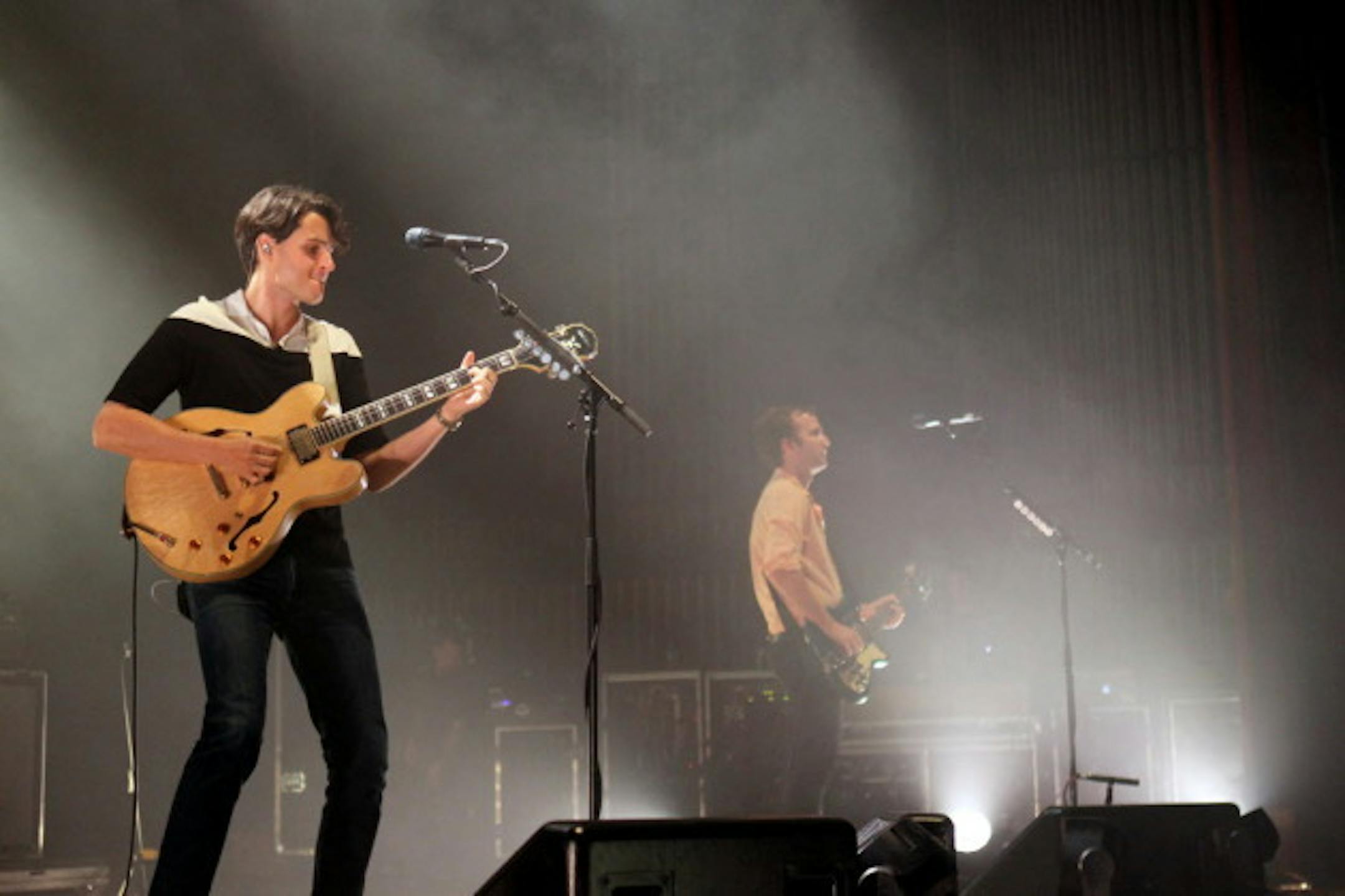 Vampire Weekend's Ezra Koenig, left, and Chris Baio played under bright white lights throughout the Orpheum Theatre on Monday. / Anna Reed, Star Tribune