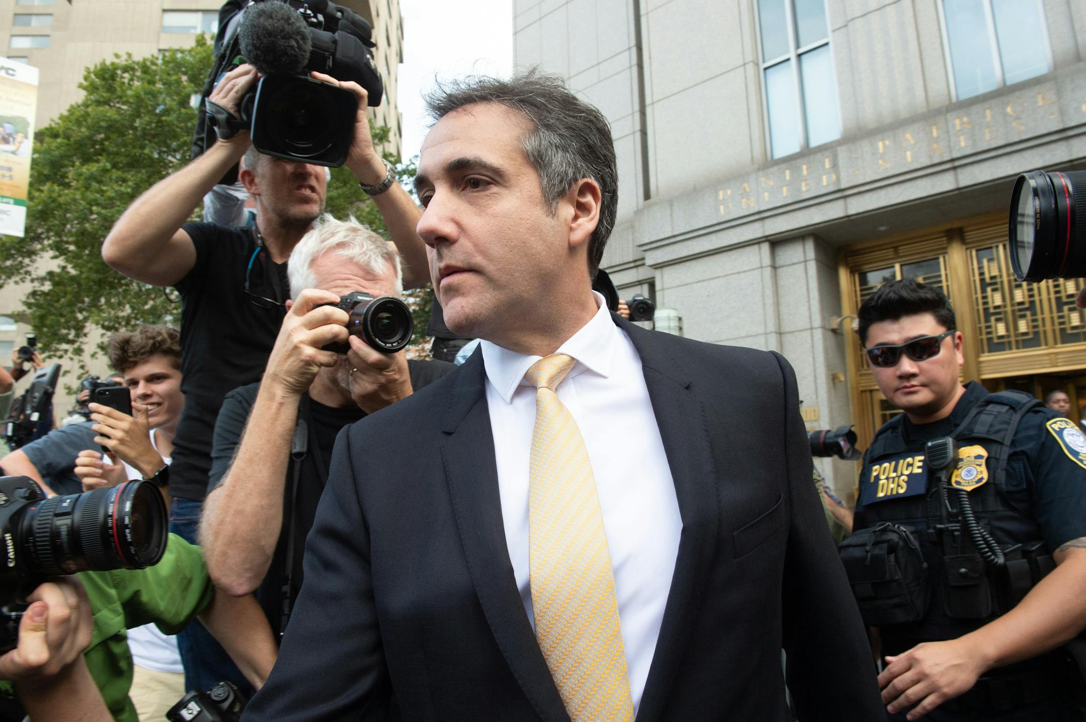 President Donald Trump's longtime personal lawyer, Michael Cohen, leaves New York Federal Court after making a plea deal on Tuesday, Aug. 21, 2018.