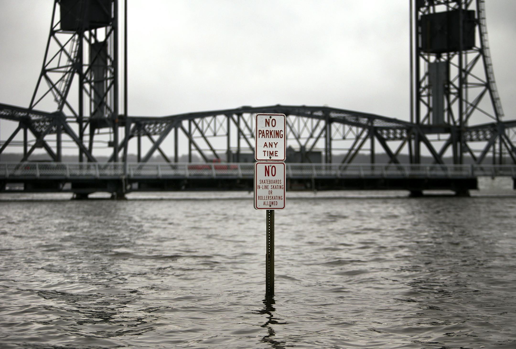 Several days of rain have left area rivers swollen and, in some cases, spilling over their banks. Above: the St. Croix River in downtown Stillwater on Wednesday.