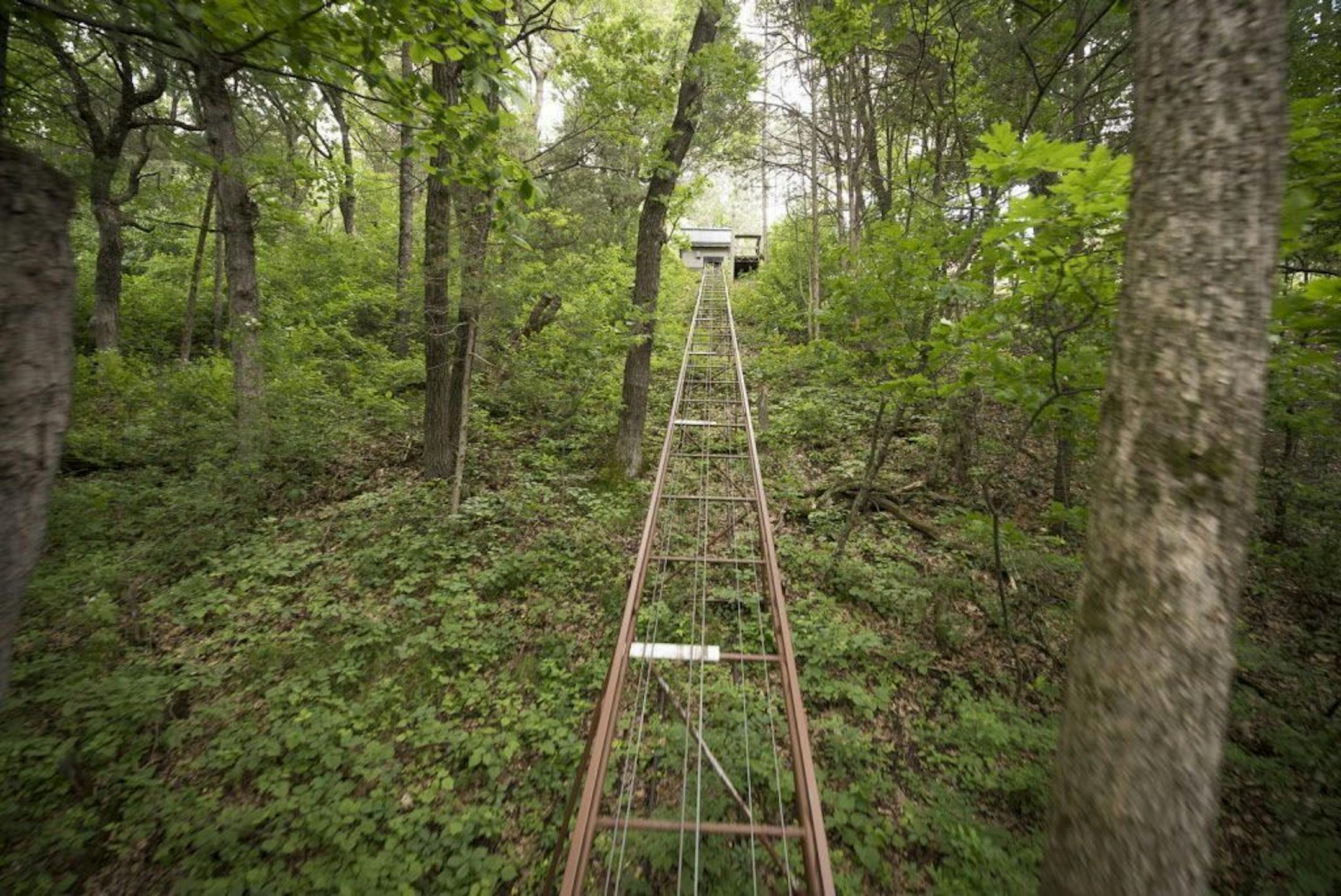 A tram carries people and supplies from the bluff down to the river. There's also a foot path.