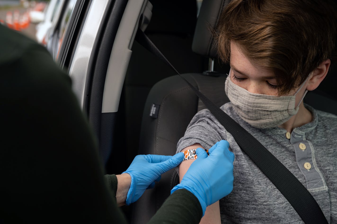 Elias Israelsen, 12, received their first COVID-19 vaccine on Thursday, May 13, 2021, at Community Health Center, Inc., in East Hartford, Conn. Immunity to the coronavirus lasts at least a year, possibly a lifetime, improving over time especially after vaccination, according to two new studies.