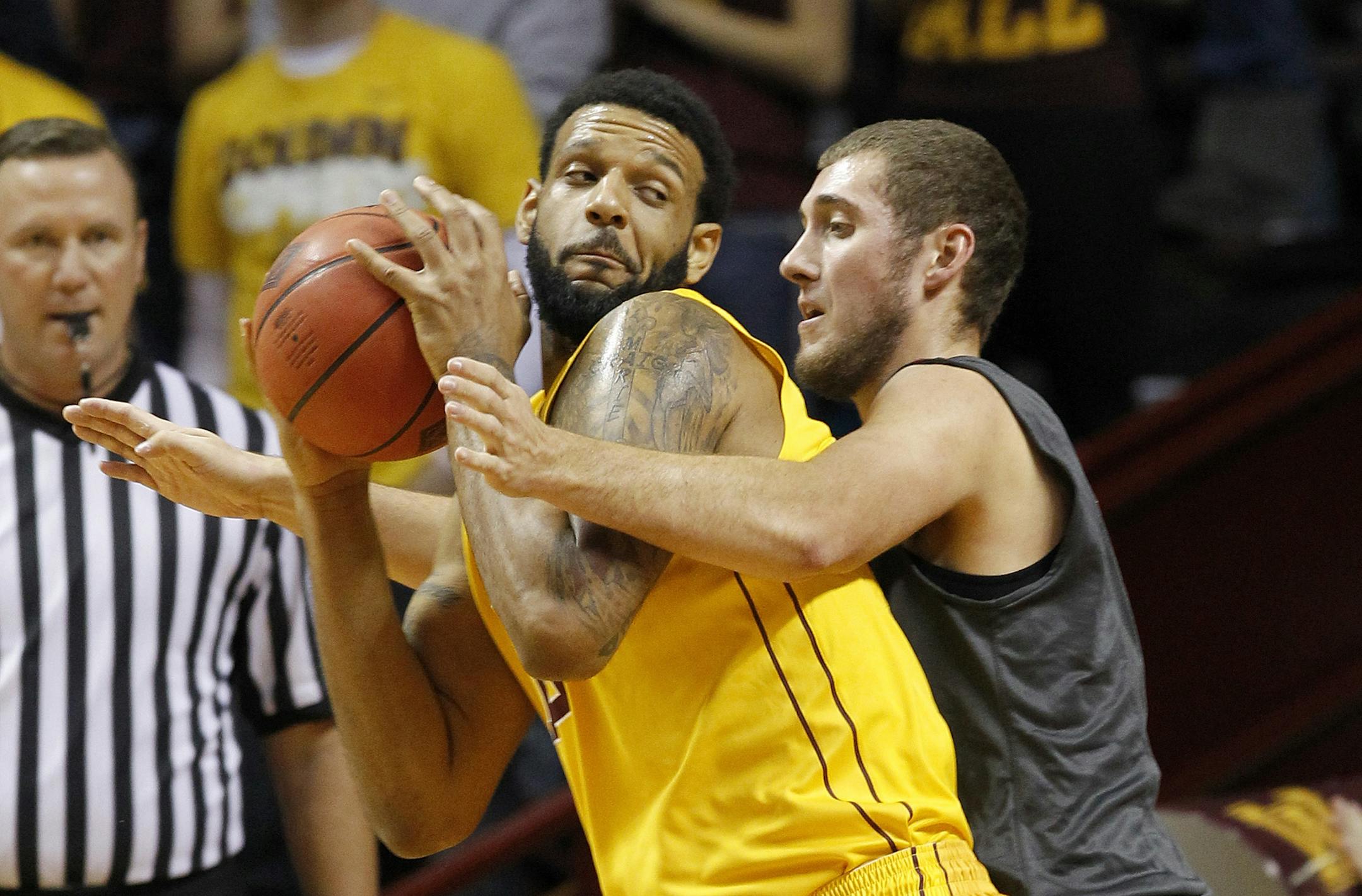 Minnesota forward Maurice Walker, left, drives against Franklin Pierce center Mike McDevitt, right, during the first half of an NCAA college basketball game in Minneapolis, Thursday, Nov. 20, 2014. (AP Photo/Ann Heisenfelt) Mo Walker.