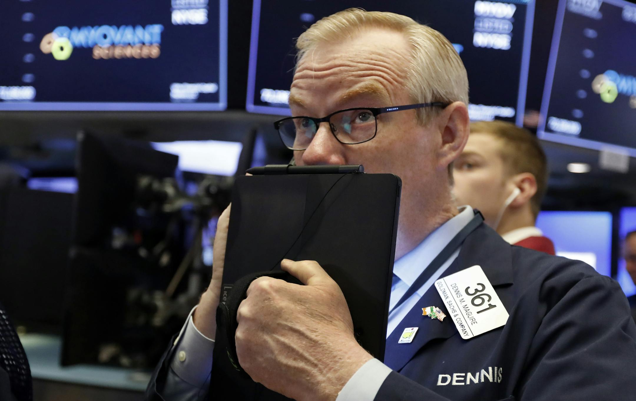 Trader Dennis Maguire works on the floor of the New York Stock Exchange, Thursday, July 18, 2019. U.S. stocks moved lower in early trading on Wall Street Thursday after Netflix reported a slump in new subscribers and dragged down communications companies. (AP Photo/Richard Drew)