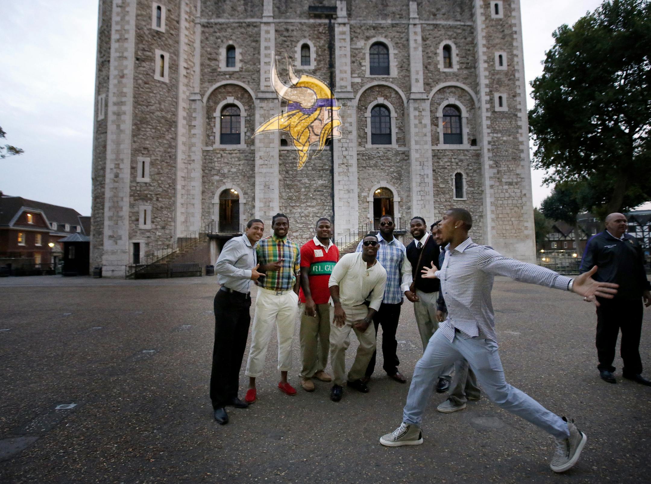 Minnesota Vikings defensive back Chris Cook photo bombed teammates as they posed for a picture in front of a Vikings logo projection on The White Tower at the Tower of London on Friday evening. ] CARLOS GONZALEZ cgonzalez@startribune.com September 27, 2013, London, England (Minnesota Vikings in London) Vikings visit The Tower of London