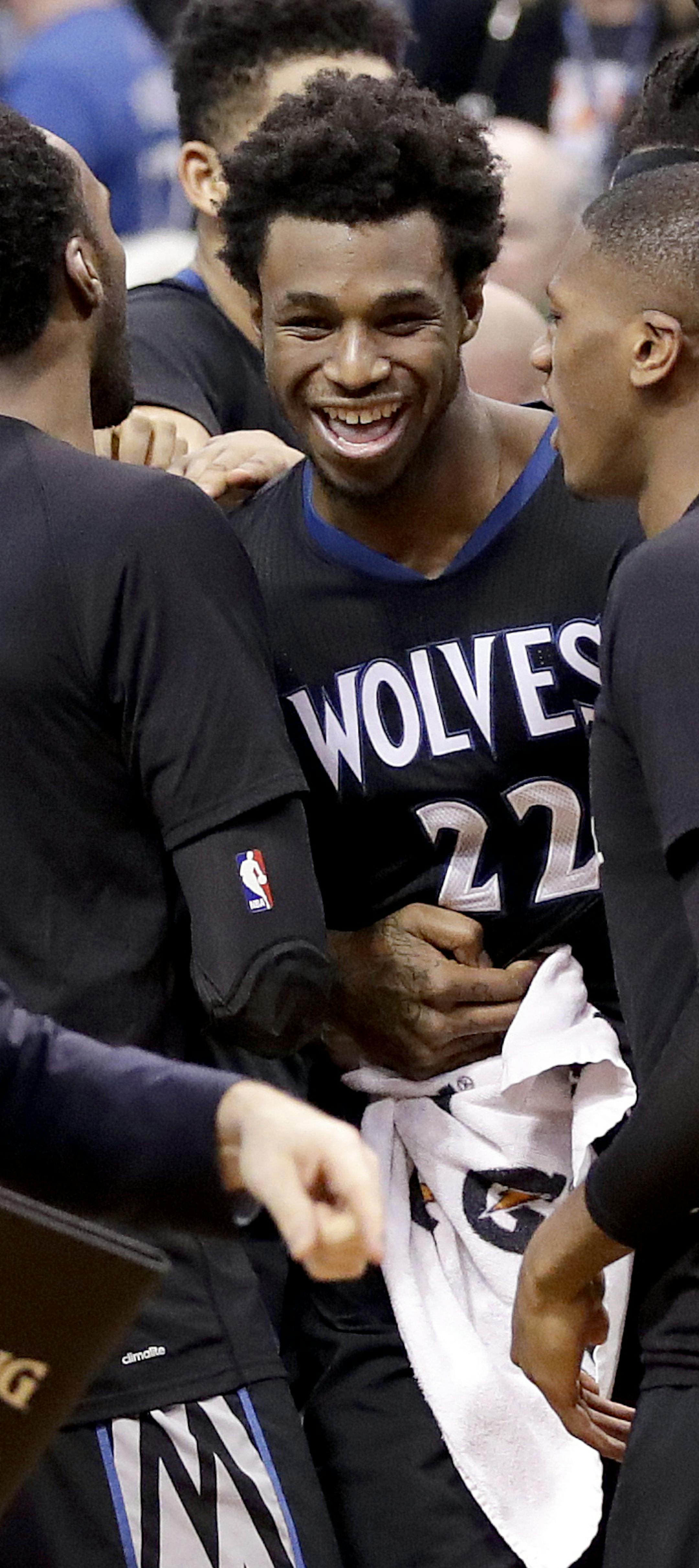 Minnesota Timberwolves forward Andrew Wiggins (22) celebrates with his teammates after making the game winning basket against the Phoenix Suns during the second half of an NBA basketball game, Tuesday, Jan. 24, 2017, in Phoenix. The Timberwolves won 112-111. (AP Photo/Matt York)