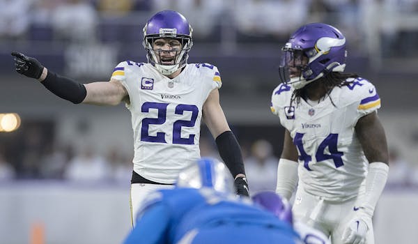 Vikings safety Harrison Smith with Josh Metellus during Sunday’s game against the Lions. 