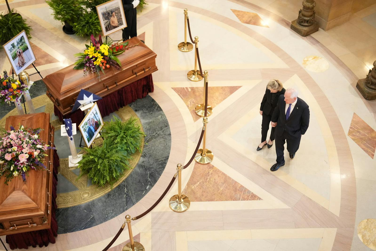 Gov. Tim Walz and his wife Gwen Walz walk into the rotunda during the Lying in State of Minnesota State Representative Melissa Hortman, Mark Hortman and their dog, Gilbert, at the Minnesota State Capital in St. Paul, Minn. on Friday, June 27, 2025.  [ALEX KORMANN • Alex.Kormann@startribune.com]