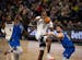 Minnesota Timberwolves center Naz Reid (11) was fouled by Dallas Mavericks guard Luka Doncic (77) as he drove to the net in the second quarter Monday 