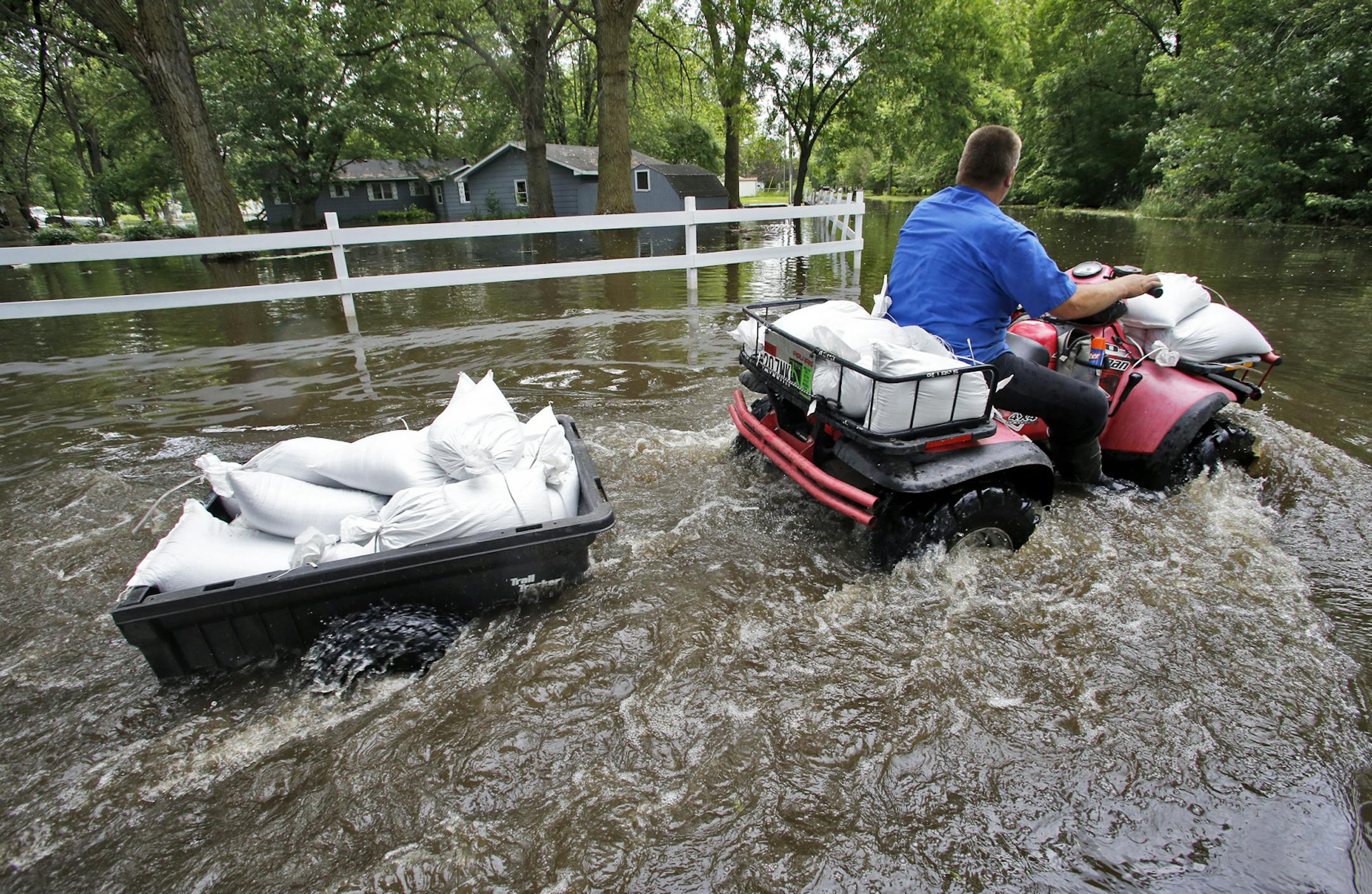 Waterville residents sandbag homes along the shoreline of Lake Tetonka where homes are being flooded as a result of recent heavy rains. ] . (MARLIN LEVISON/STARTRIBUNE(mlevison@startribune.com)