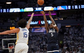 Timberwolves guard Anthony Edwards shoots and scores a three-pointer against Golden State Warriors forward Gui Santos in the fourth quarter in Game 5
