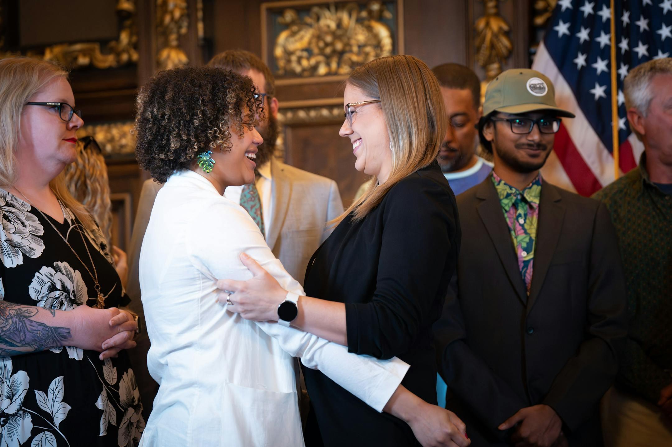 Sen. Clare Oumou Verbeten, DFL-St. Paul and Rep. Jessica Hanson, DFL-Burnsville, co sponsors of the bill, greeted each other at the bill signing Tuesday, May 30, 2023 St. Paul, Minn. Former Governor Jesse Ventura was on hand as Gov. Tim Walz legalized marijuana in Minnesota with the stroke of a pen on Tuesday, May 30, 2023. (Glen Stubbe/Minneapolis Star Tribune/TNS) ORG XMIT: 80805808W