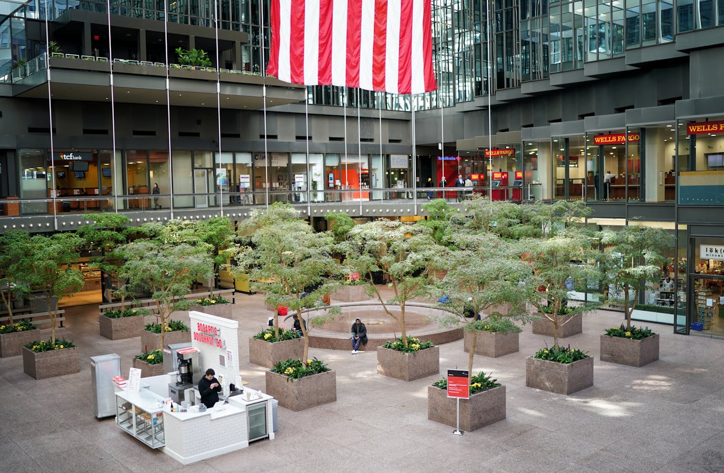 The IDS Center Crystal Court was unusually quiet for a weekday lunch hour. A few people were still moving around in downtown Minneapolis but nothing near the lunch hour weekday crowds. ] GLEN STUBBE &#x2022; glen.stubbe@startribune.com Tuesday, March 17, 2020 The scene in downtown Minneapolis as the heart of the state's largest city shuts down.