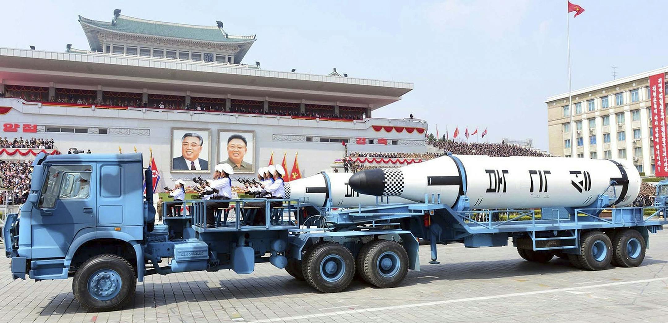 In this Saturday, April 15, 2017, photo distributed by the North Korean government, Polaris submarine launched ballistic missiles (SLBM) are paraded to celebrate the 105th birth anniversary of Kim Il Sung, the country's late founder, in Pyongyang, North Korea. China is defending its trade practices with North Korea after Chinese-made vehicles were seen carrying ballistic missiles during a military parade despite international sanctions against selling military hardware to Pyongyang. (Korean Cent