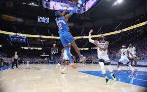 Oklahoma City Thunder guard Shai Gilgeous-Alexander (2) shoots over Timberwolves guard Mike Conley (10) in the fourth quarter at Paycom Center in Okla