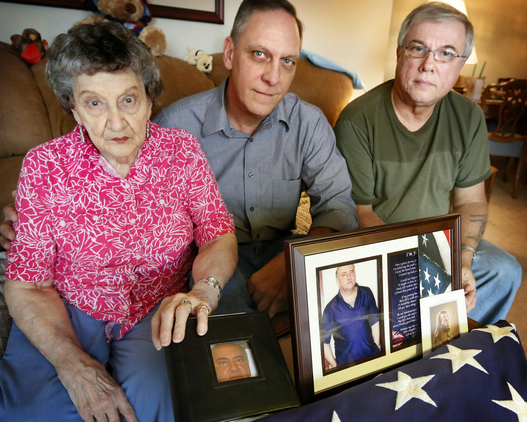 Elaine Bain and her sons Dick and Jim Bain, pose withe pictures of her son Jerry Bain, who died of a drug overdose at the Minneapolis Veterans Home. ] BRIAN PETERSON/STAR TRIBUNE