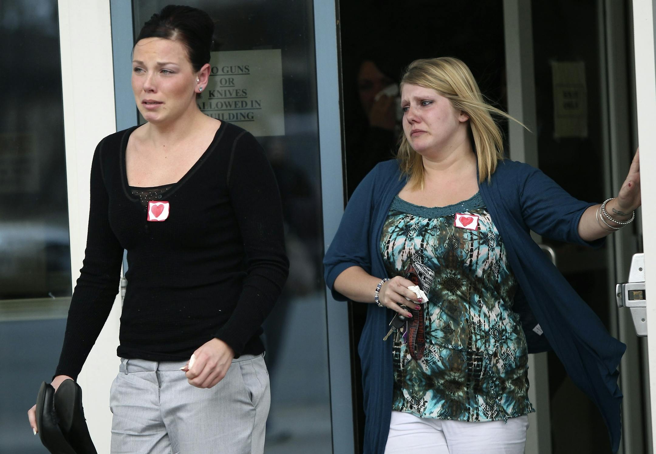 Supporters of Alexander Tuomisto, seen wearig hearts for his support, left the Wright County Courthouse in tears after his sentencing in Buffalo. Alexander Tuomisto will serve five years for the bar-brawl punch that put Adam Baker in a coma and eventually killed him.