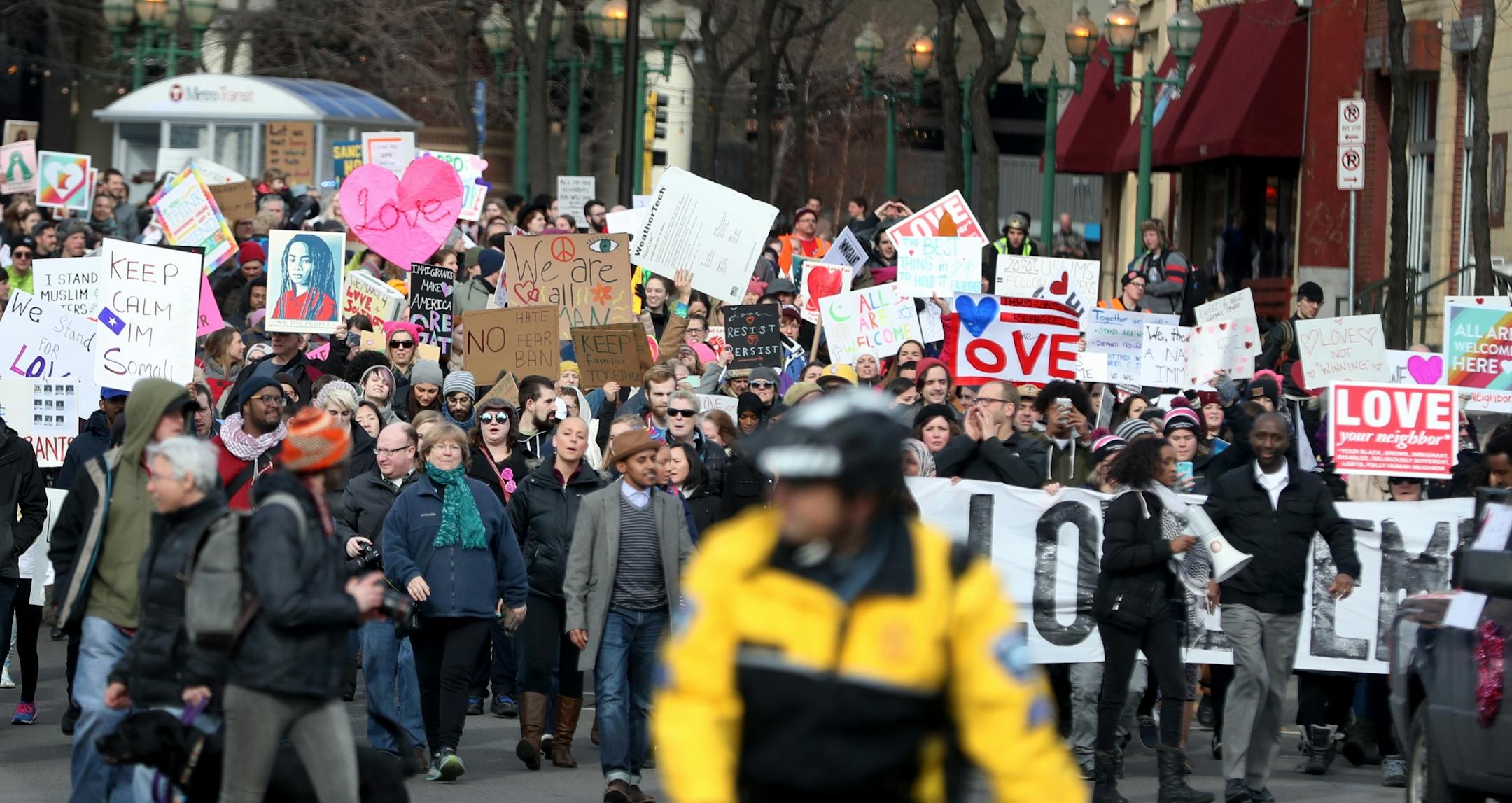A large crowd took place in The Caravan of Love: A Walk of Love for Immigrants and Refugees as it moved from the Minneapolis City Hall down Washington Ave. towards the Cedar-Riverside neighborhood.