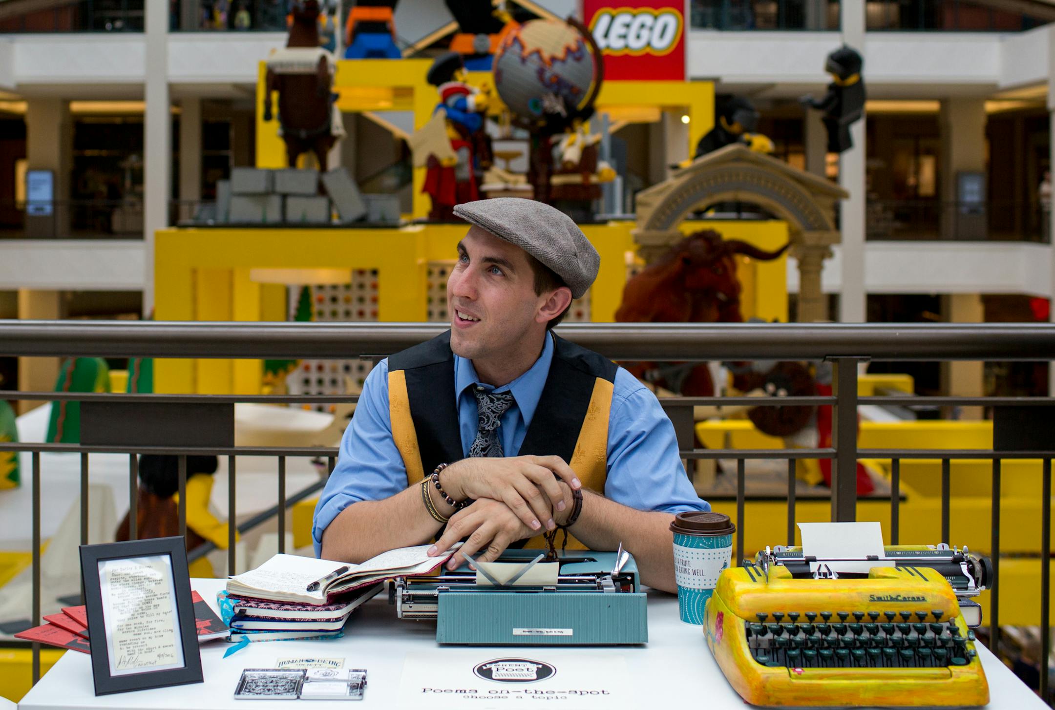 Brian Sonia-Wallace looks up before writing poetry on a typewriter for people he meets in the Mall of America. ] COURTNEY PEDROZA &#x2022; courtney.pedroza@startribune.com June 14, 2017 Bloomington; Brian Sonia-Wallace writes poetry for strangers who walk up to him in the Mall of America