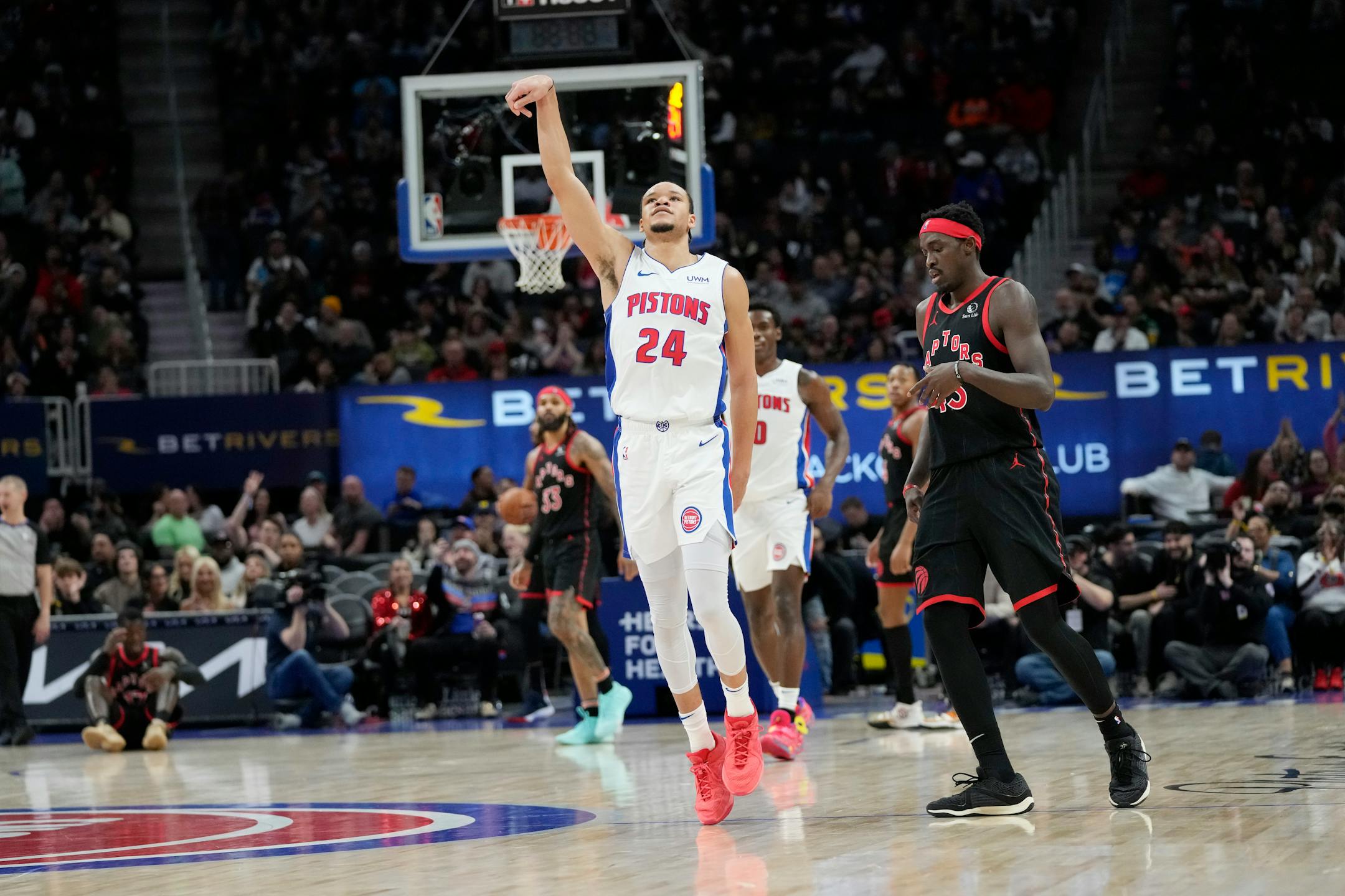 Pistons forward Kevin Knox II reacts after a three-point basket during the first half against the Toronto Raptors