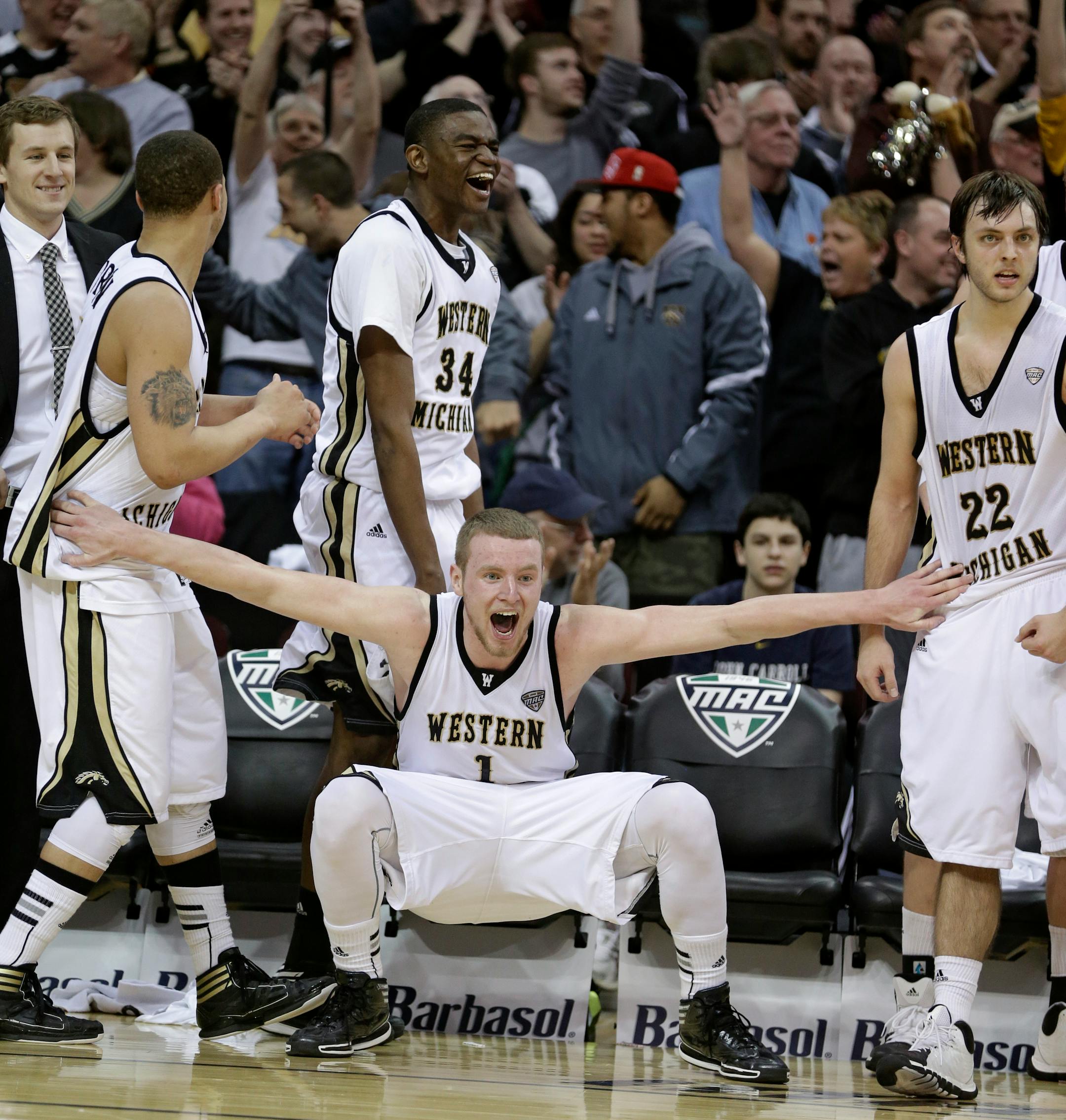 Western Michigan's Tucker Haymond (1) celebrates in the final seconds of an NCAA college basketball championship game against Toledo at the Mid-American Conference tournament Saturday, March 15, 2014, in Cleveland. (AP Photo/Tony Dejak)