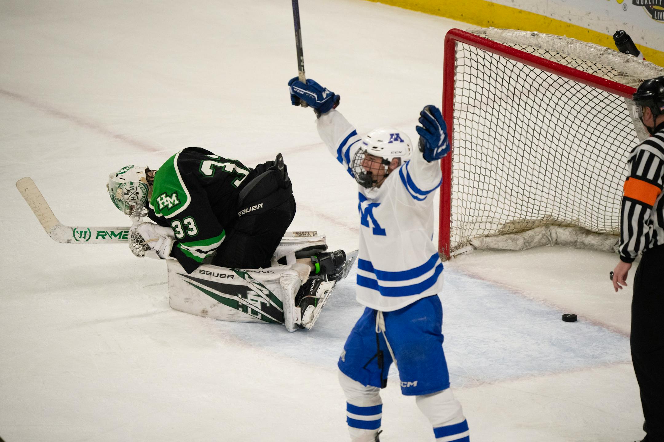 Hill-Murray Pioneers goaltender Jack Erickson (33) reacted after Minnetonka Skippers defenseman John Stout (23) scored on him from the point for the win in overtime.