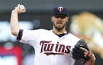 Minnesota Twins pitcher Phil Hughes throws against the Oakland Athletics in the first inning of a baseball game Monday, May 4, 2015, in Minneapolis.