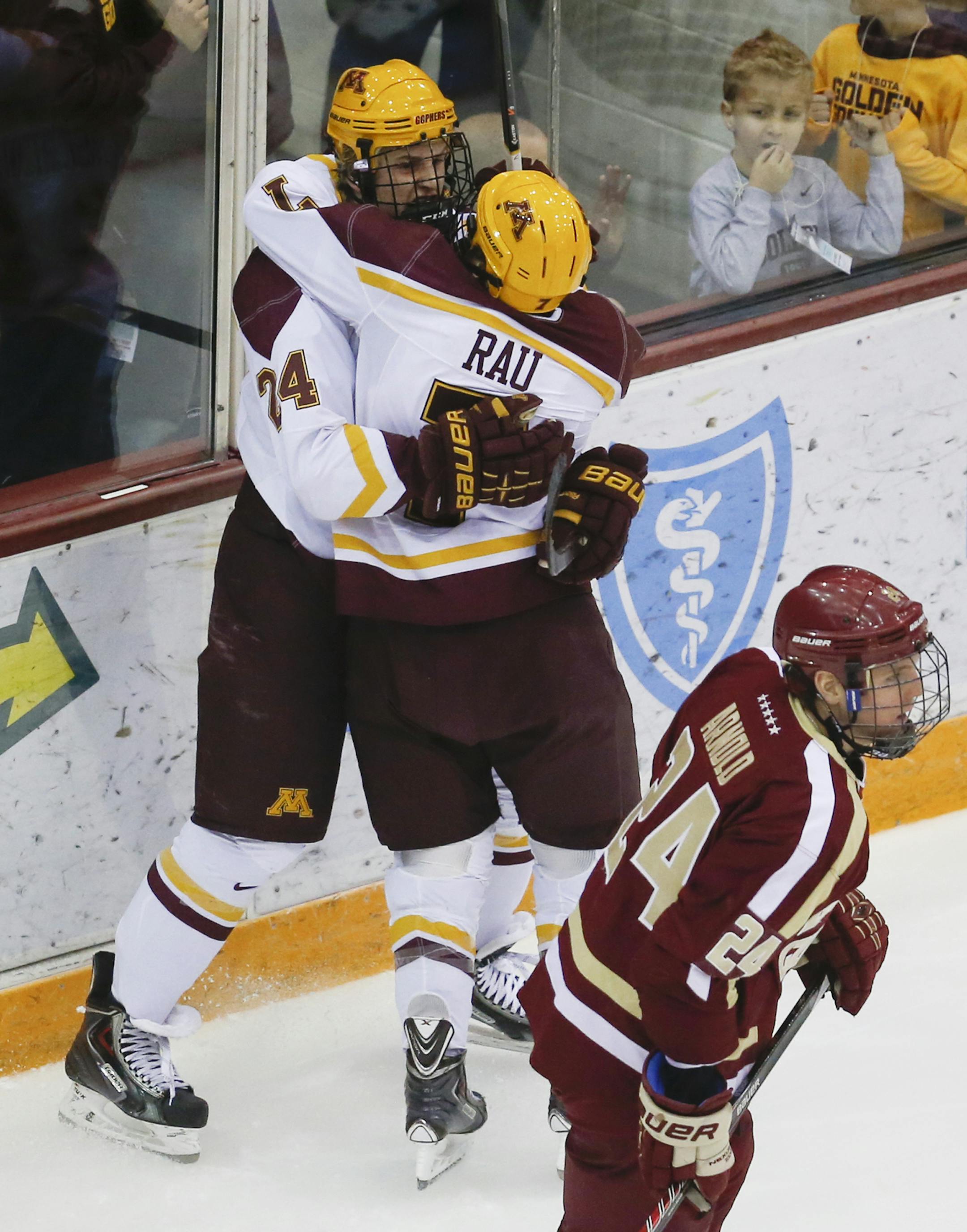 The University of Minnesota's Hudson Fasching (24), celebrates his first period goal with teammate Kyle Rau as Boston College college's Bill Arnold (24) skates by Friday, Oct. 25, 2013, at Mariucci Arena in Minneapolis, MN.](DAVID JOLES/STARTRIBUNE) djoles@startribune.com University of Minnesota versus Boston College in men's hockey at Mariucci Arena Friday, Oct. 25, 2013, in Minneapolis, MN.