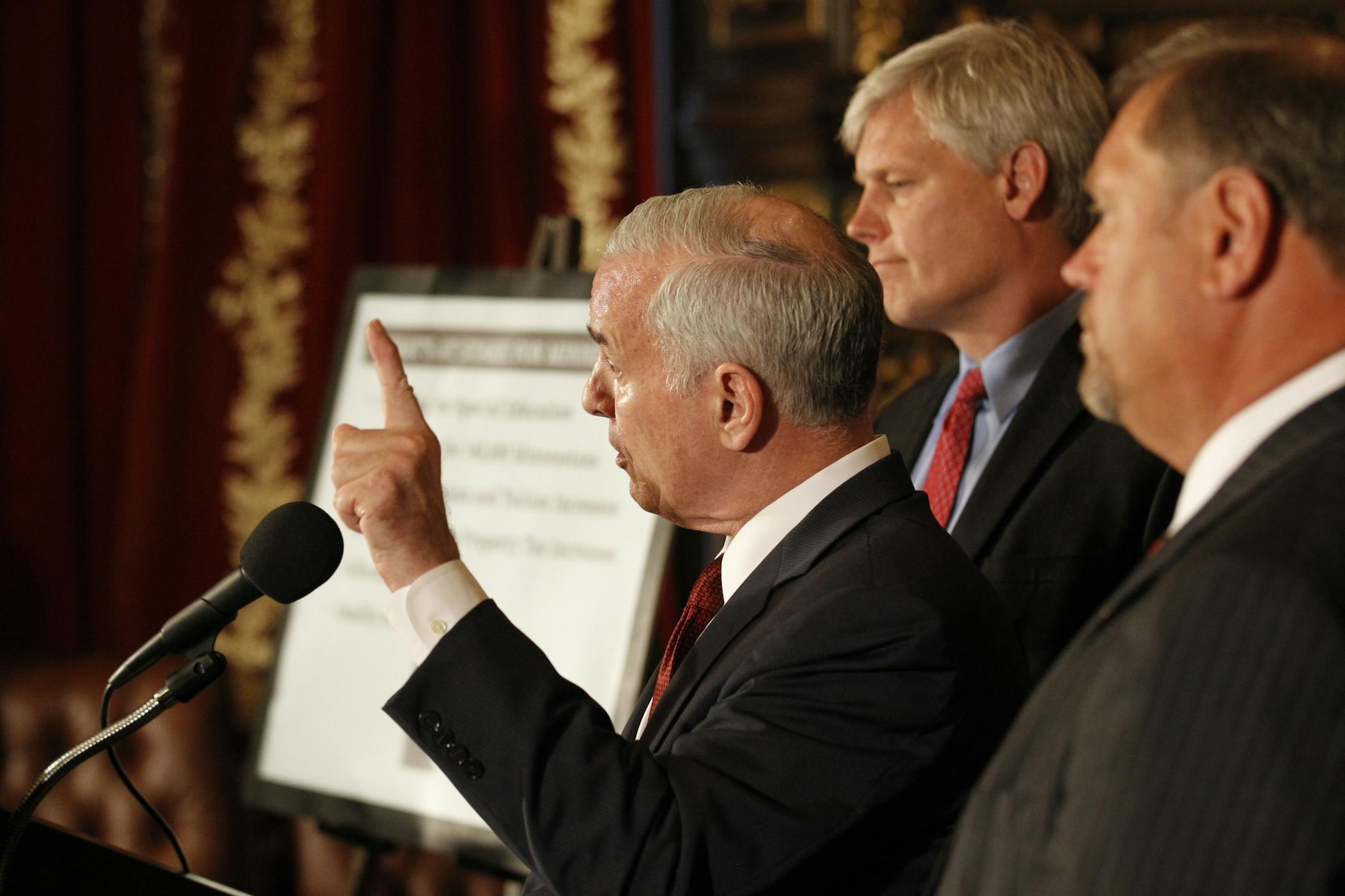 Gov. Mark Dayton spoke Wednesday at a press conference about the budget stalemate and potentional government shutdown. He was joined by Rep. Paul Thissen (center) and Sen. Tom Bakk .