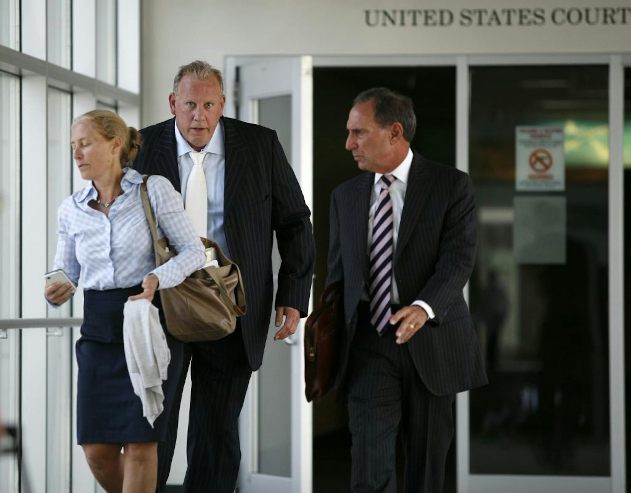 David Marion,center, left the federal building in Minneapolis on Thursday after receiving the 5 year sentence.