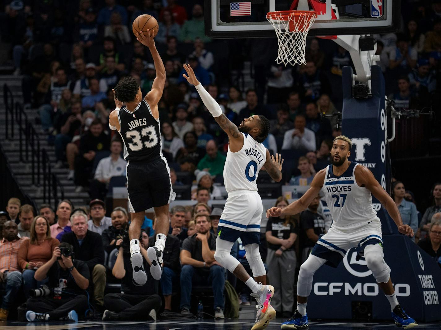 San Antonio guard Tre Jones (33) put up a first half shot over the defense of Minnesota Timberwolves guard D'Angelo Russell (0) while Minnesota Timberwolves center Rudy Gobert (27) awaited a rebound Monday, Oct. 24, 2022 at Target Center in Minneapolis. The Minnesota Timberwolves faced the San Antonio Spurs in an NBA basketball game. ] JEFF WHEELER • Jeff.Wheeler@startribune.com