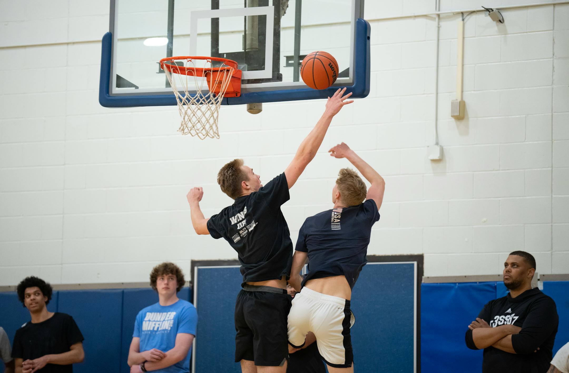 Head coach Jonathan Williams observed as Grayson Grove blocked a shot by Patrick Rowe during practice at Wayzata Central Middle School in Plymouth.
