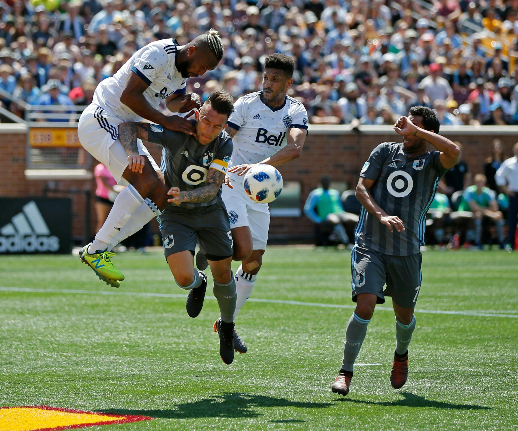 The Loons' Francisco Calvo battled Vancouver's Kendall Waston (left) and Sean Franklin