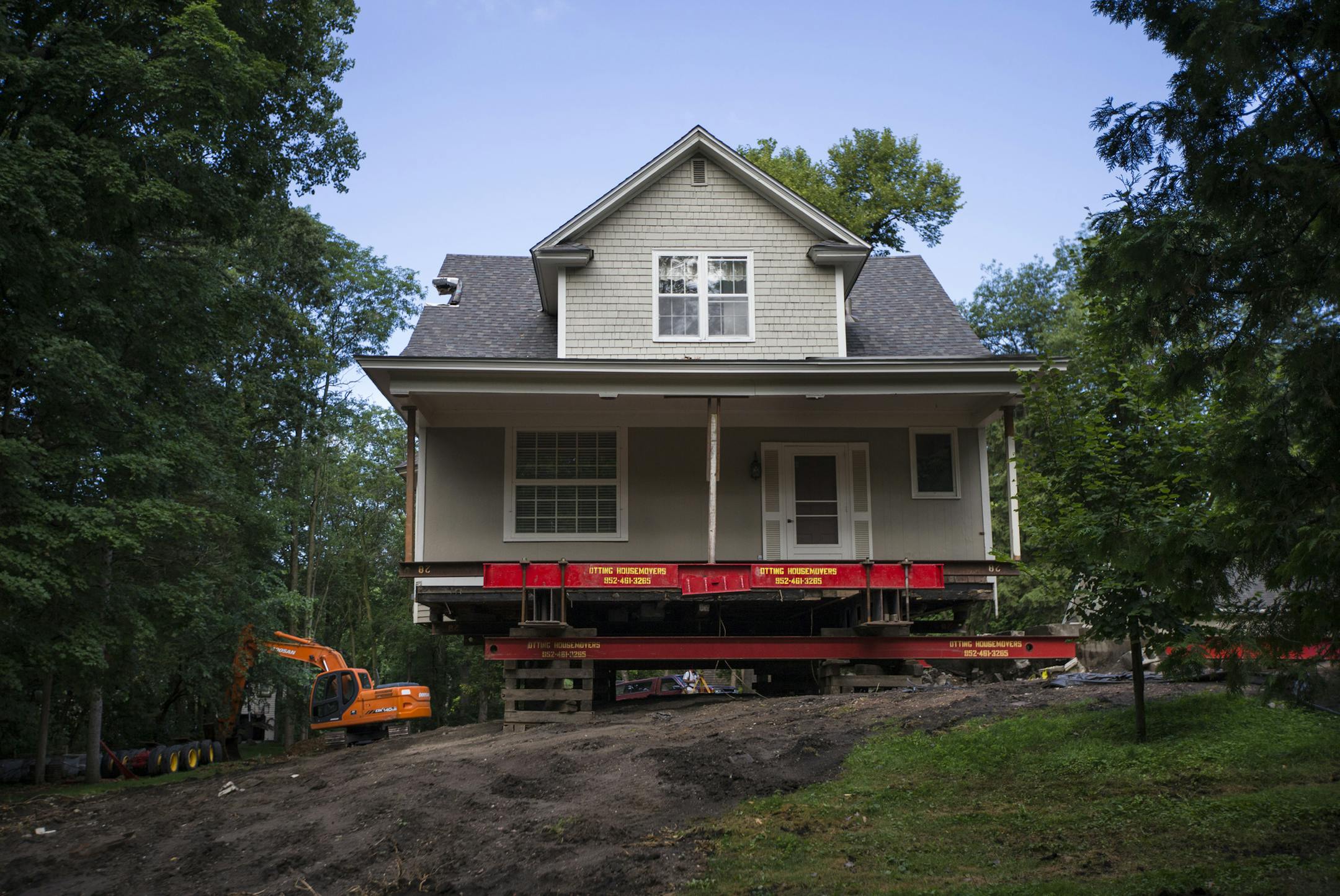 The house, built by Thomas Wise, is one of six in Wayzata left from 1904, according to the historical society. It has been lifted up to be moved to a new site.