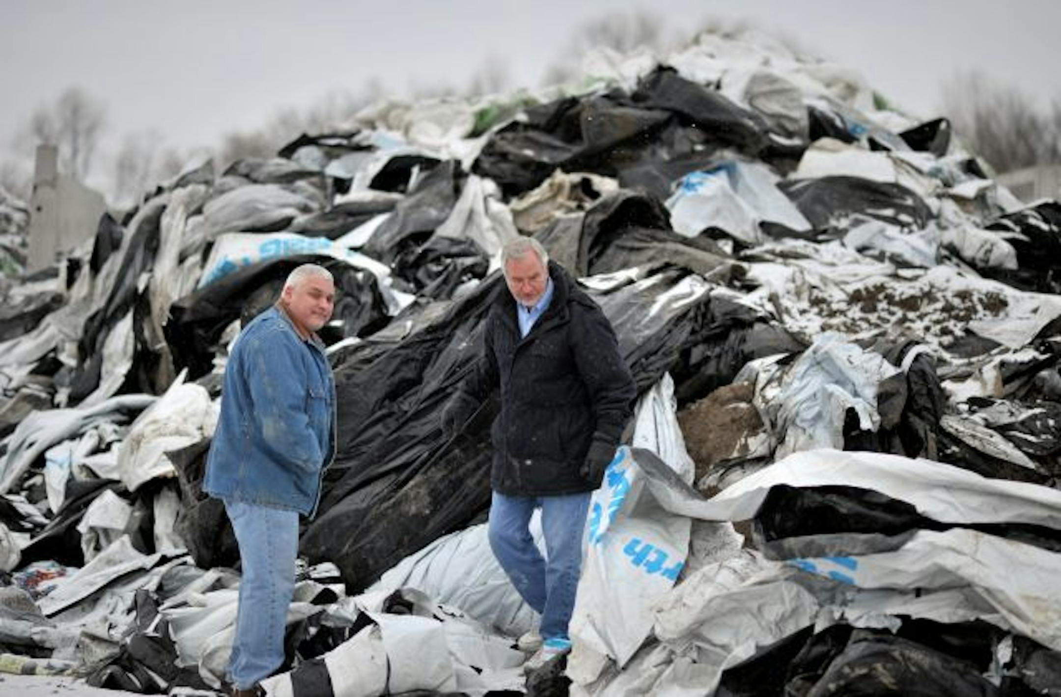 John Schmitz, left and Dan Hauschild, run Genesis Poly Recycling and will soon be recycling agricultural plastics like this at vendor Bueckers Sanitary in Sauk Centre, Minn.