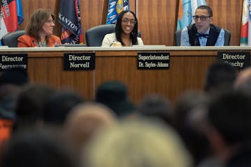 New Superintendent of Minneapolis Public Schools Dr. Lisa Sayles-Adams (middle) speaks during a school board meeting in February.