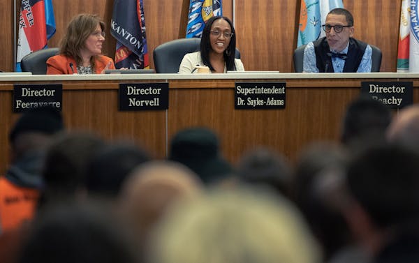 New Superintendent of Minneapolis Public Schools Dr. Lisa Sayles-Adams (middle) speaks during a school board meeting in February.